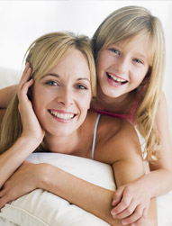 woman and young girl smiling